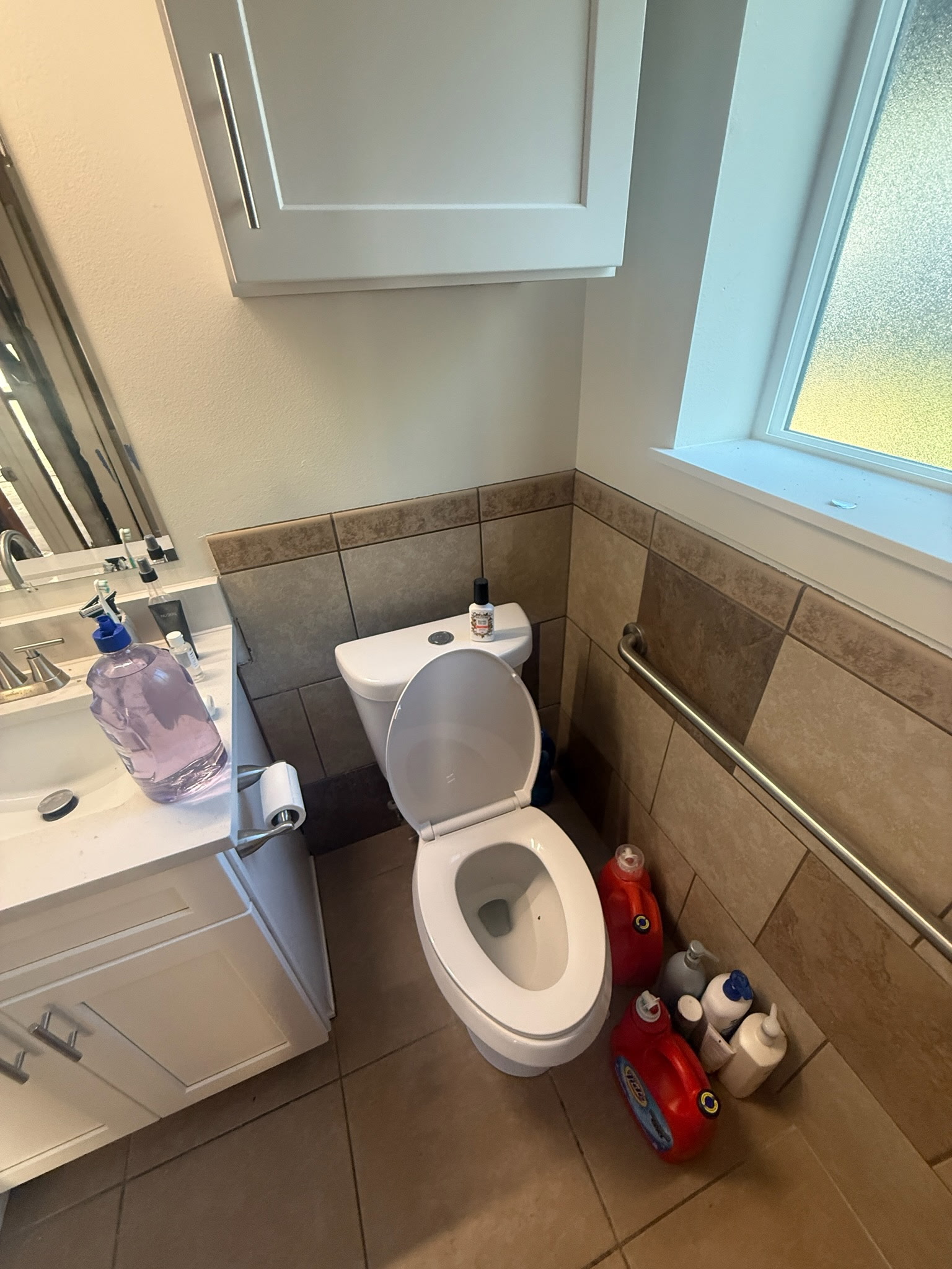 Bathroom tile wainscoting before removal in Orem, Utah